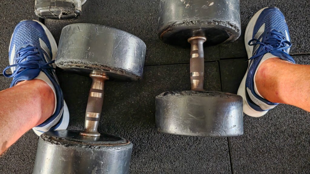 Dumbbells on the gym floor after a strength workout
